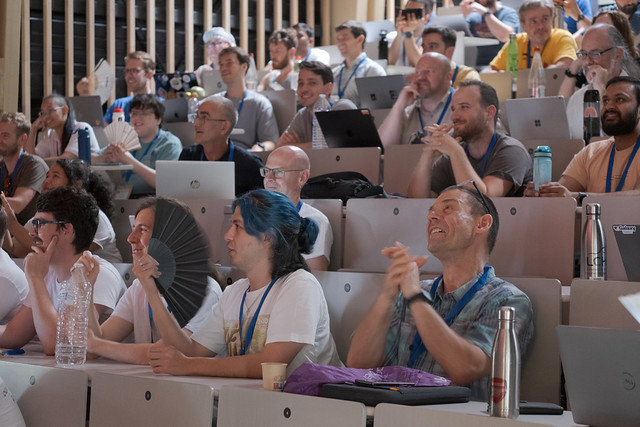 GCC2026 attendees in the audience during a conference session.