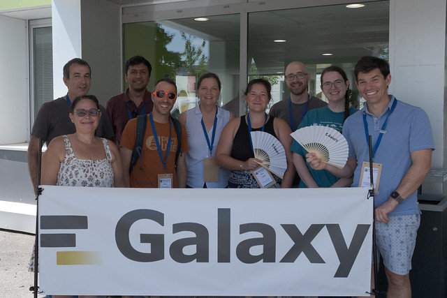 Members of the GCC2026 organizing team standing together with a Galaxy banner.