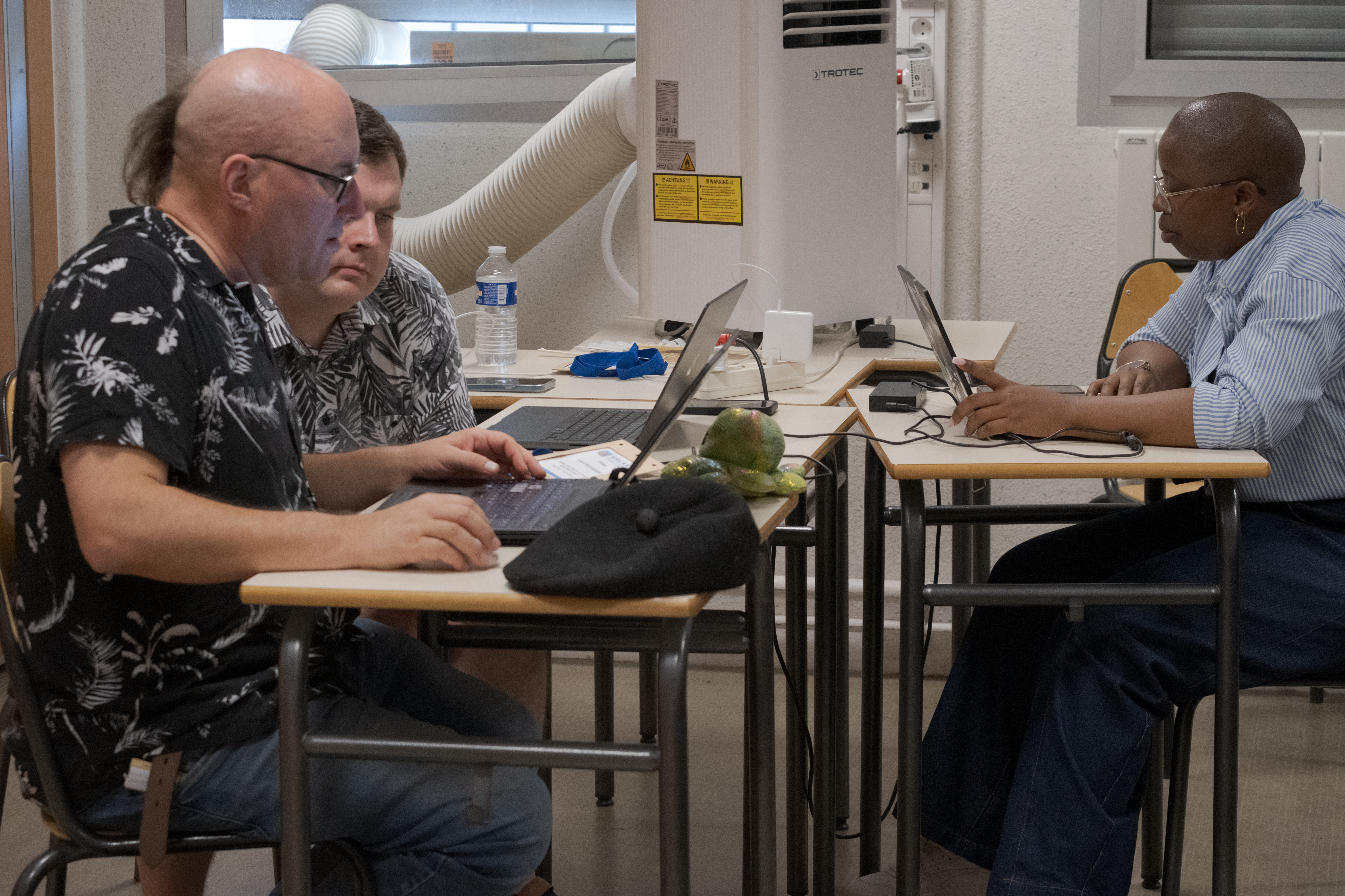 CoFest participants working on tool wrapping for public health pathogen genomics.
